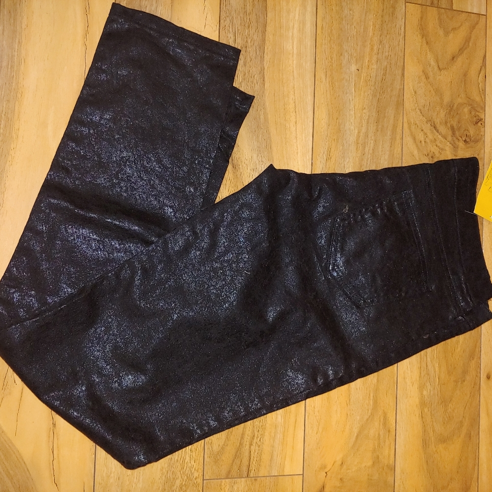 Never worn coated black jeans with very little str